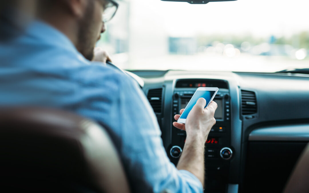 Adult male texting while driving